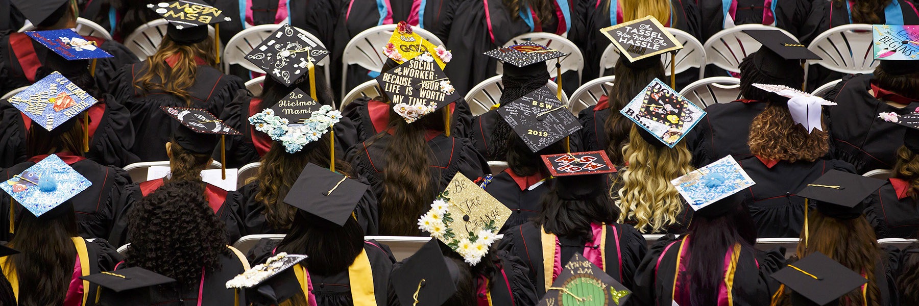 IU student during commencement, wearing a cap and gown